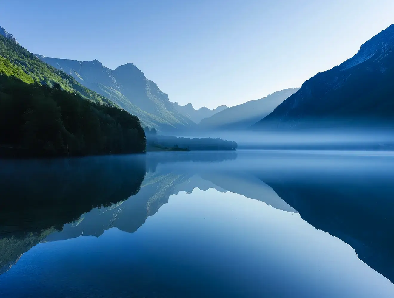 Lake with mist and mountains