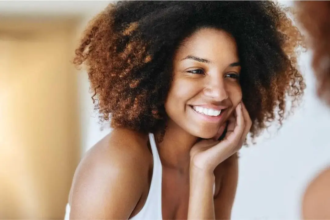 Woman smiling with healthy, clear skin